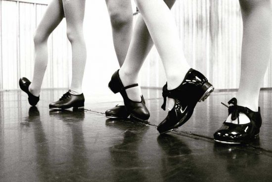 Dancing feet in a dance studio.
